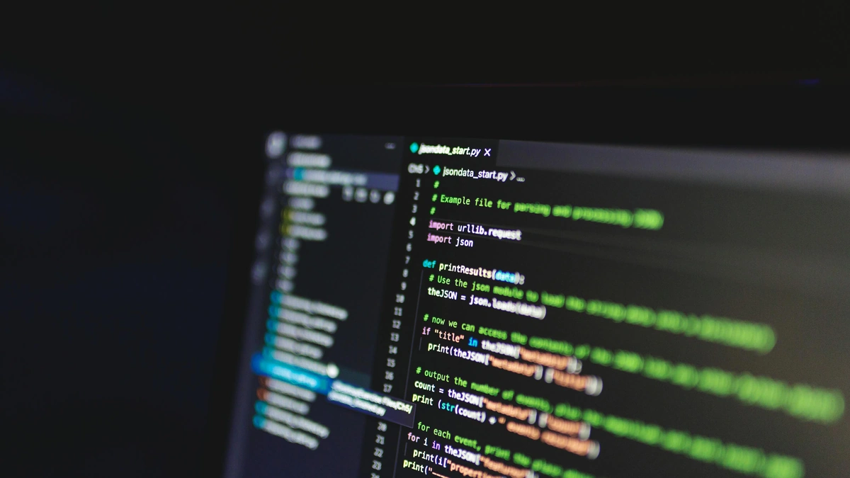 A code editor open in a dark room, the kind of late-night build that ships before anyone checks it